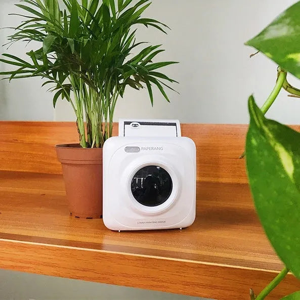Paperang mini Bluetooth thermal printer in white, 83x83x45mm, with thermal paper roll