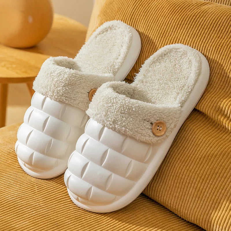 Plaid detachable slippers for women with plush lining and EVA sole in pink, shown on a wooden floor.