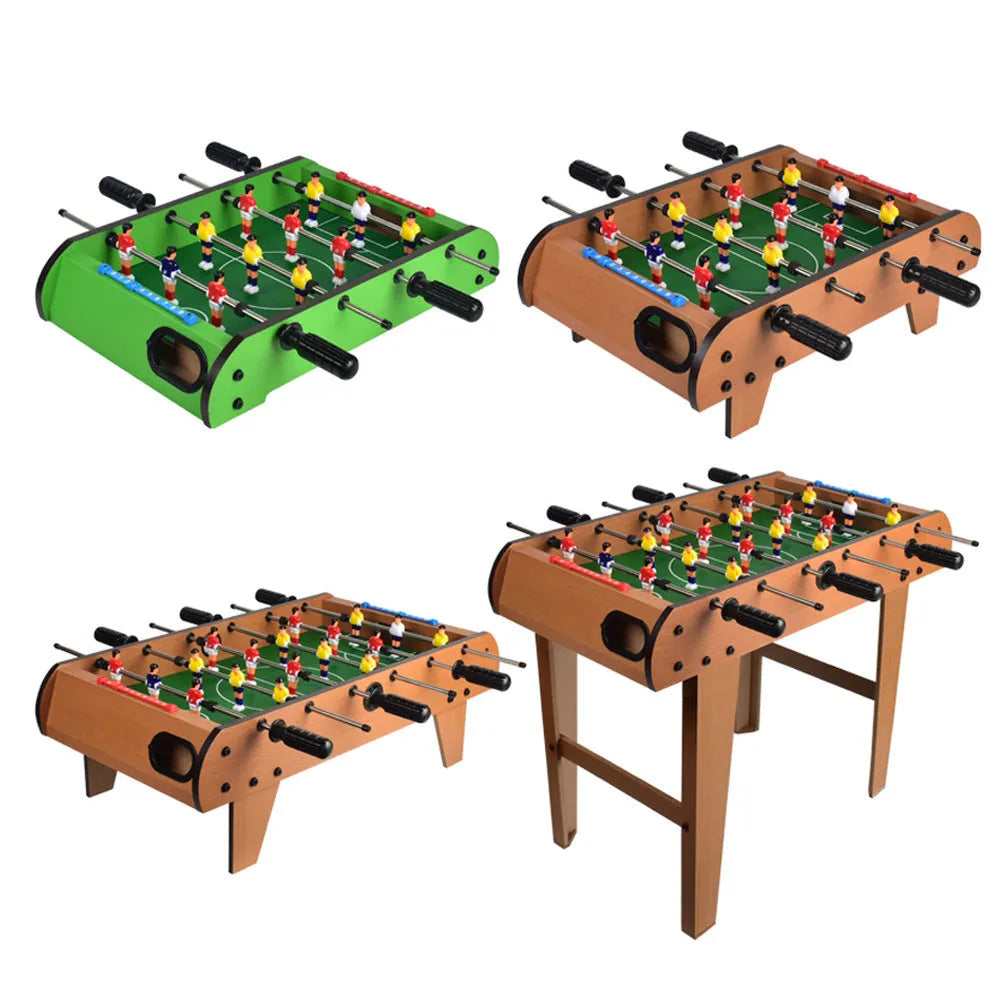 Wooden table football machine with two sets of coloured player figures on a green playing field, ready for two-person play