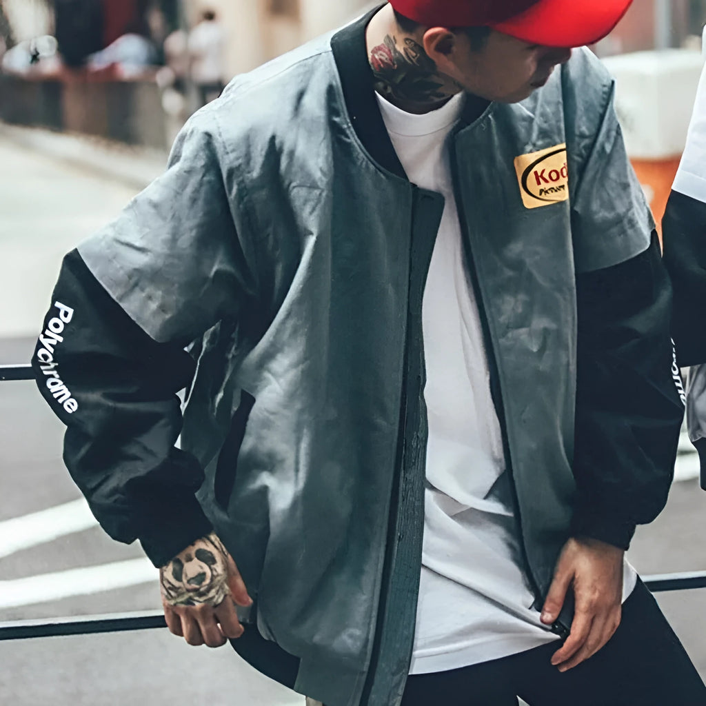 Hip hop style cotton print baseball jacket for men and women, grey colour, front view with side pockets