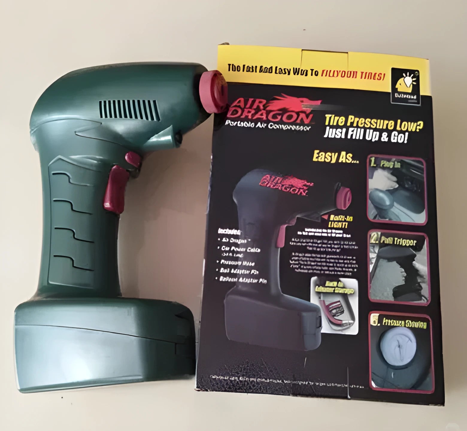 Portable 12V electric car tyre inflator with power cable and hose for emergency use.