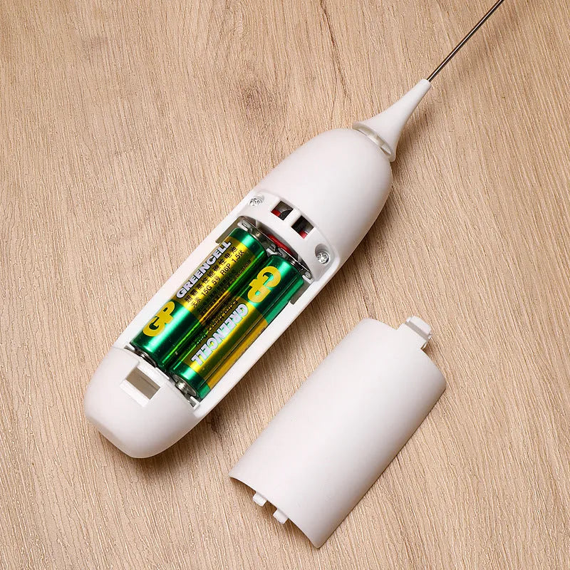 Black and white electric hand-held milk frother and blender for coffee beverages