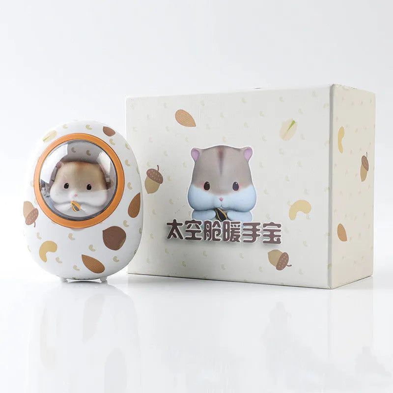 White Hamster space capsule-shaped hand warmer and power bank with USB port