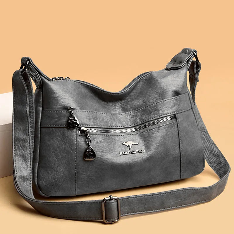 Single-shoulder women's bag in PU with soft build, urban minimalist style, shown in black, yellow, gray, red, green, blue, or purple