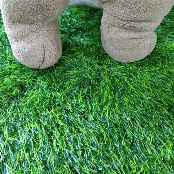Green dog grass pee pad with realistic texture and drainage holes
