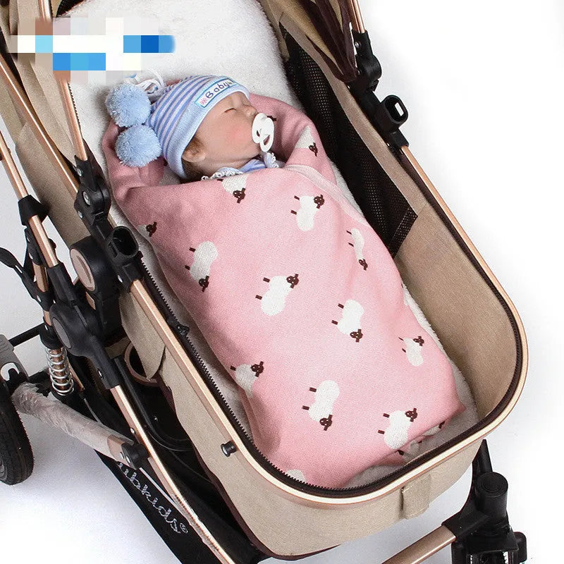Soft pink baby blanket cover for a sheepskin, laid flat showing its rectangular 100cm by 80cm size.