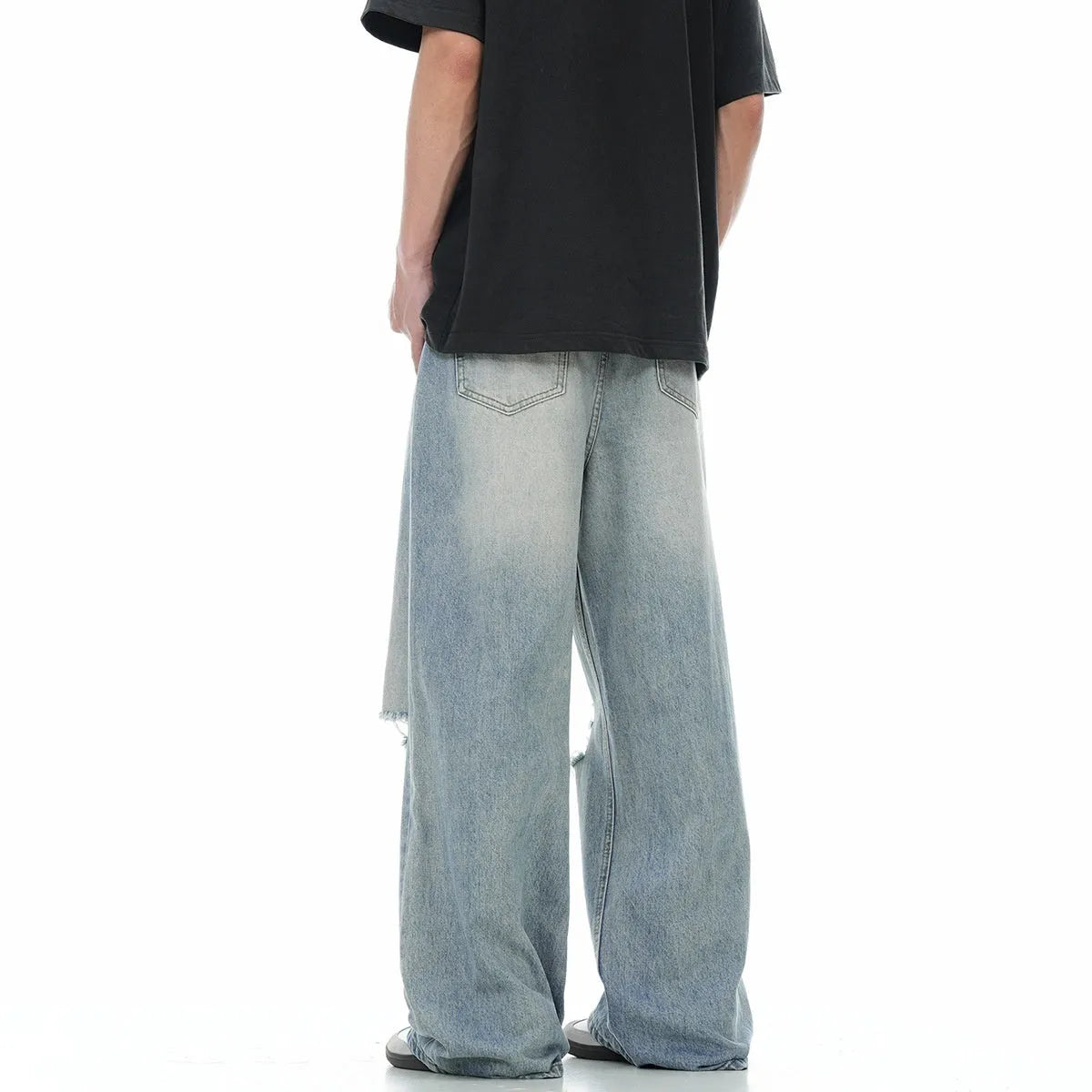 Blue cotton blend men's straight leg jeans with retro ripped detailing, front view, zipper fly, standing pose