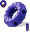 Blue natural rubber tyre-shaped dog chew toy with oval openings for treat dispensing