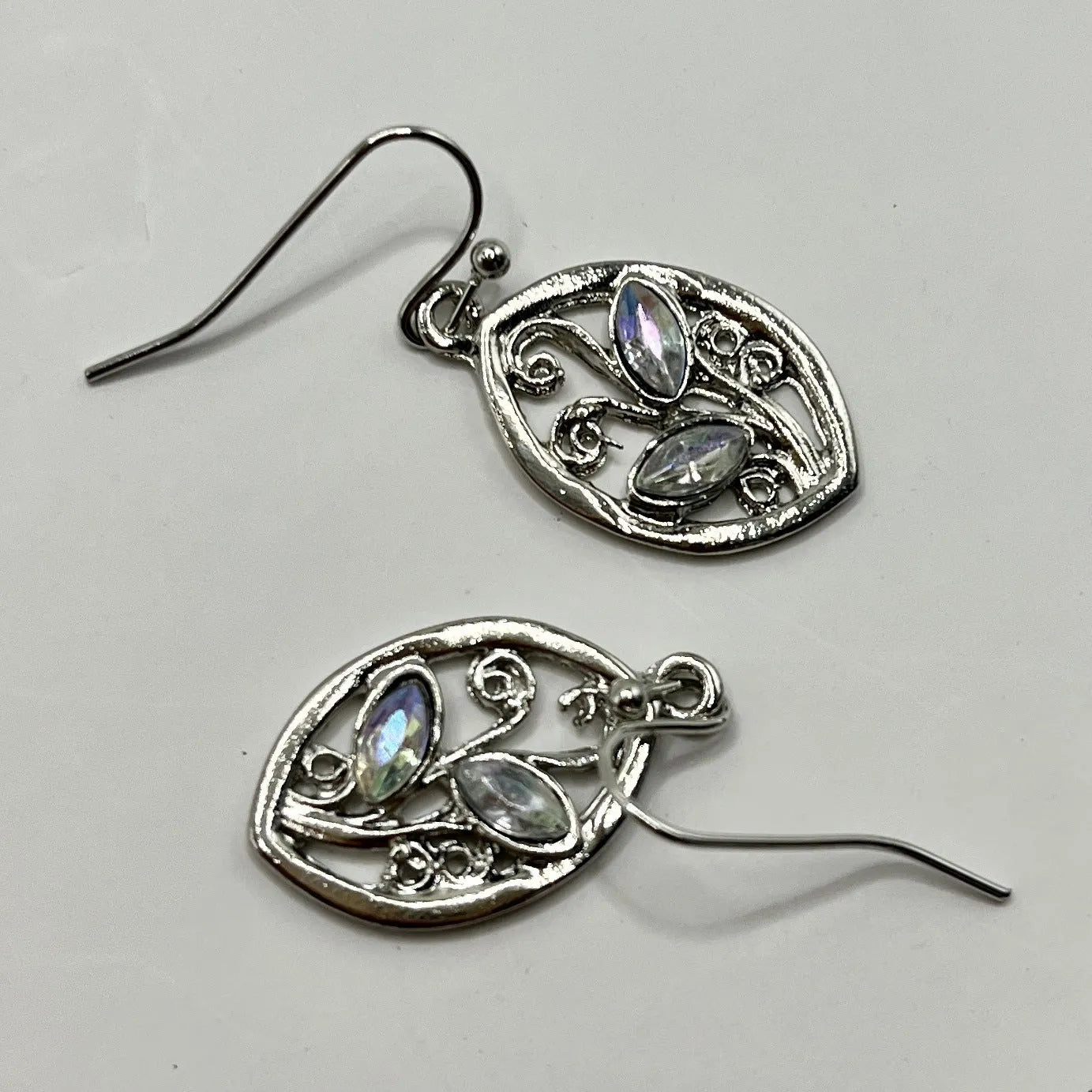 Silver leaf-shaped earrings with colourful embedded moonstone pieces and diamond treatment