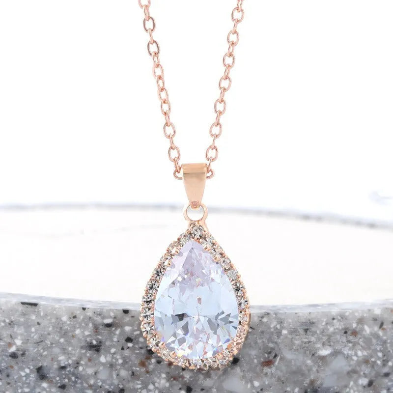 Women's drop-shaped pendant necklace with rhinestone geometric pattern in pink electroplated finish