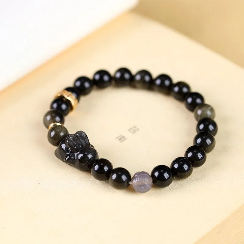 Handmade obsidian bracelet with lying rabbit charm in Jin Yaoshi and grey agate beads