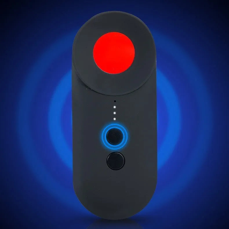 Black portable camera and GPS signal detector with USB charging port on a flat surface.