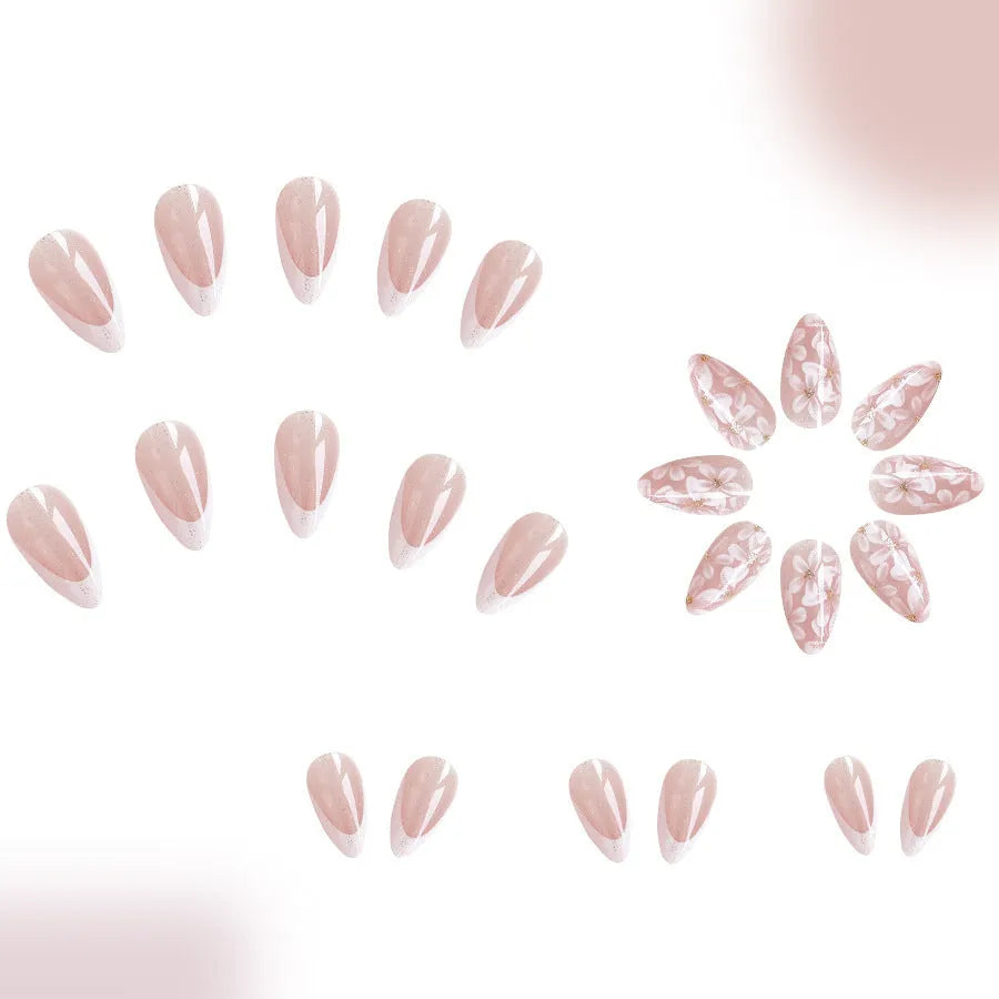 Short almond shaped artificial fingernails with French tips and glitter powder flower decorations, colour C625.