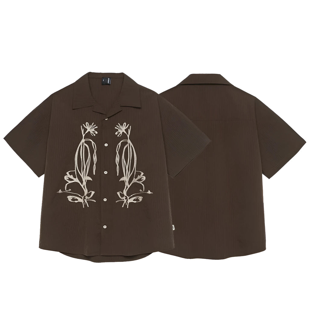 Brown striped outdoor short sleeve shirt with Cuban collar on a hanger.