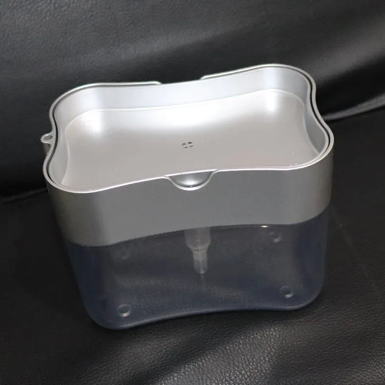 Plastic kitchen soap dispenser in silver colour on a countertop