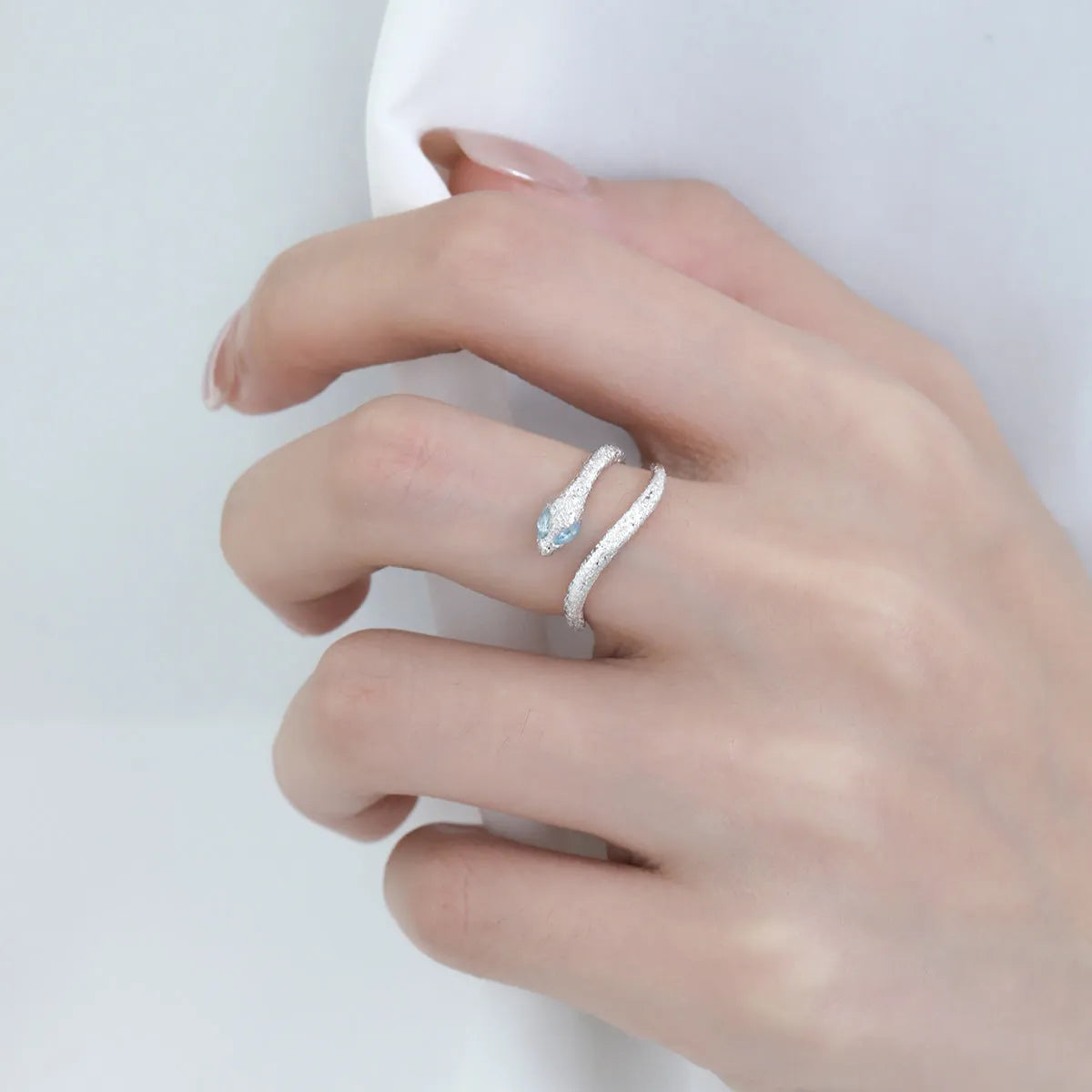 Adjustable silver-plated ring with snake design and zodiac motifs in platinum colour