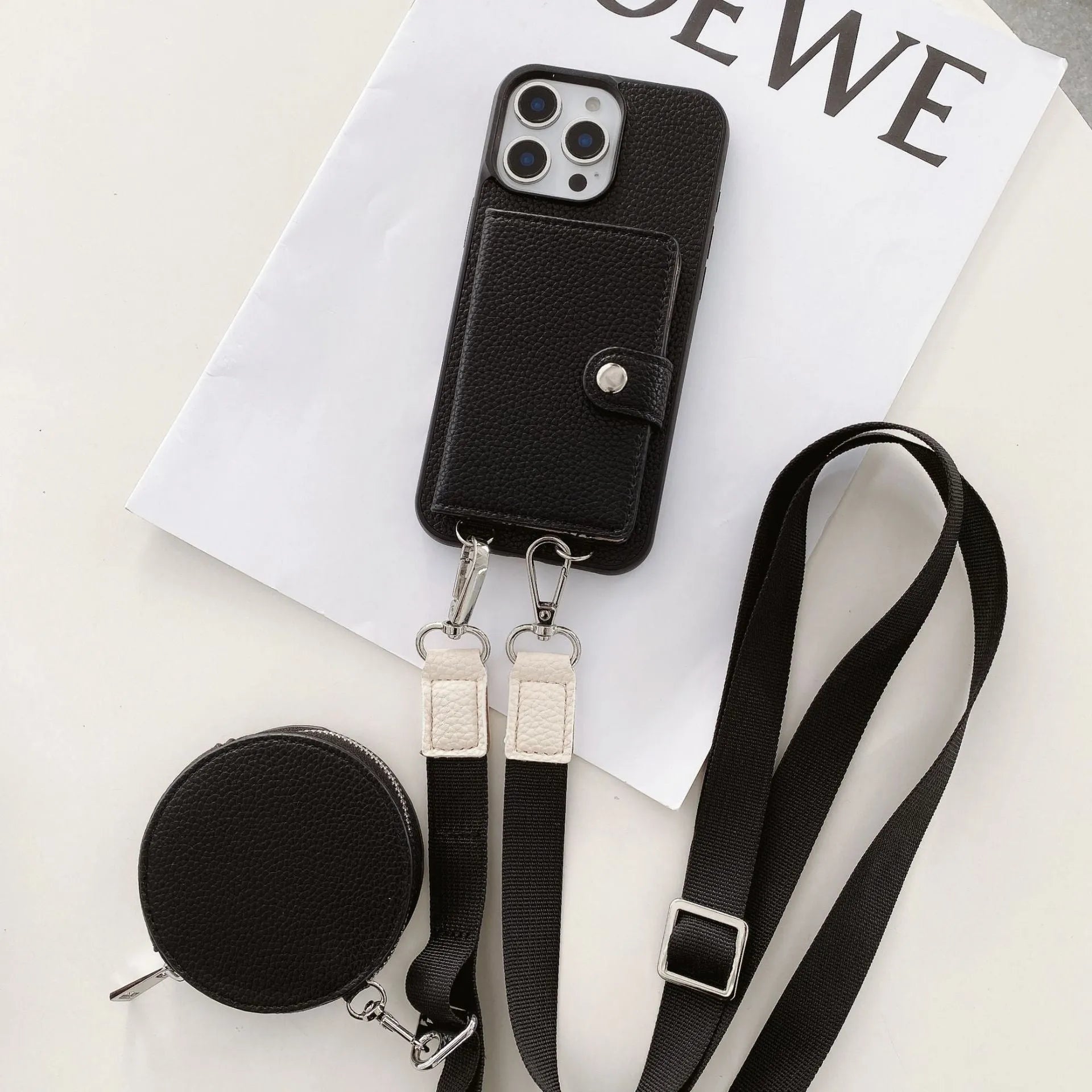 Black PC leather iPhone case with a card slot on the back and a lanyard hole at the corner.