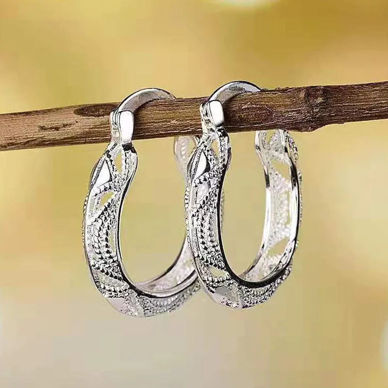Geometric metal earrings for women with electroplated silver finish, individually packed.