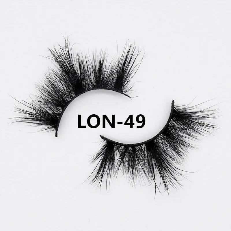 Real mink hair false eyelashes in 25MM3D length with fluffy handmade lash strands on a white background
