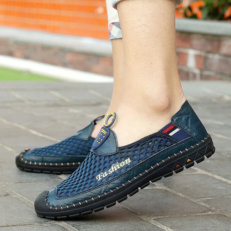 Mens brown casual shoes with mesh fabric uppers and rubber soles on a white background