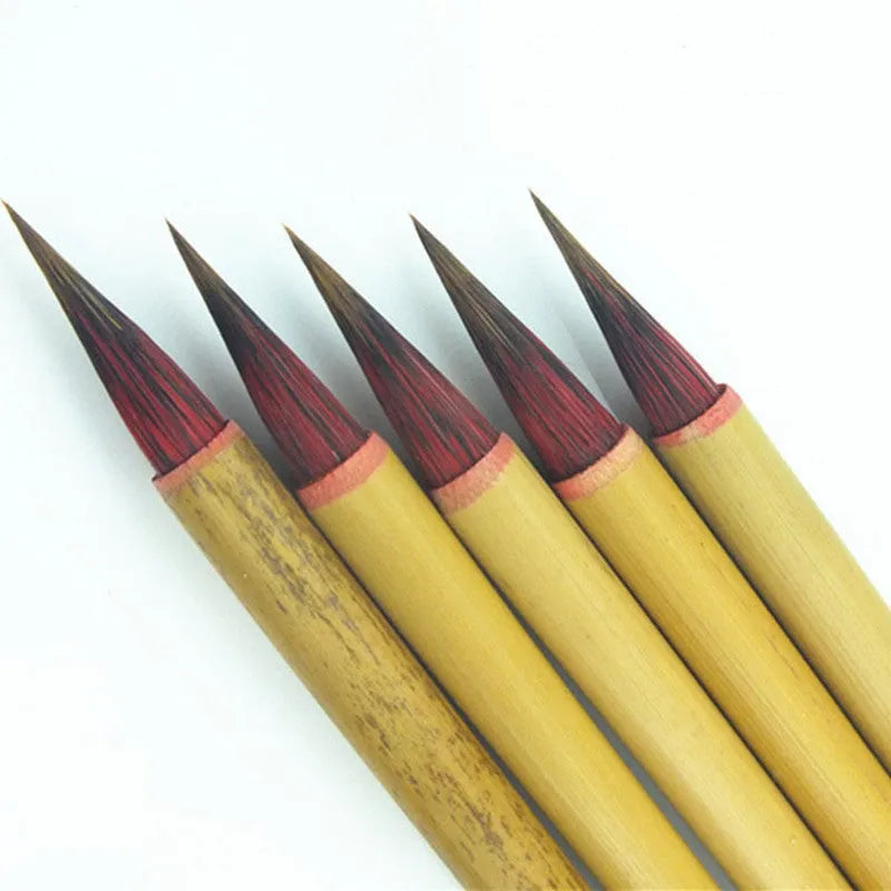 Small red Chinese writing brush with wooden penholder for calligraphy