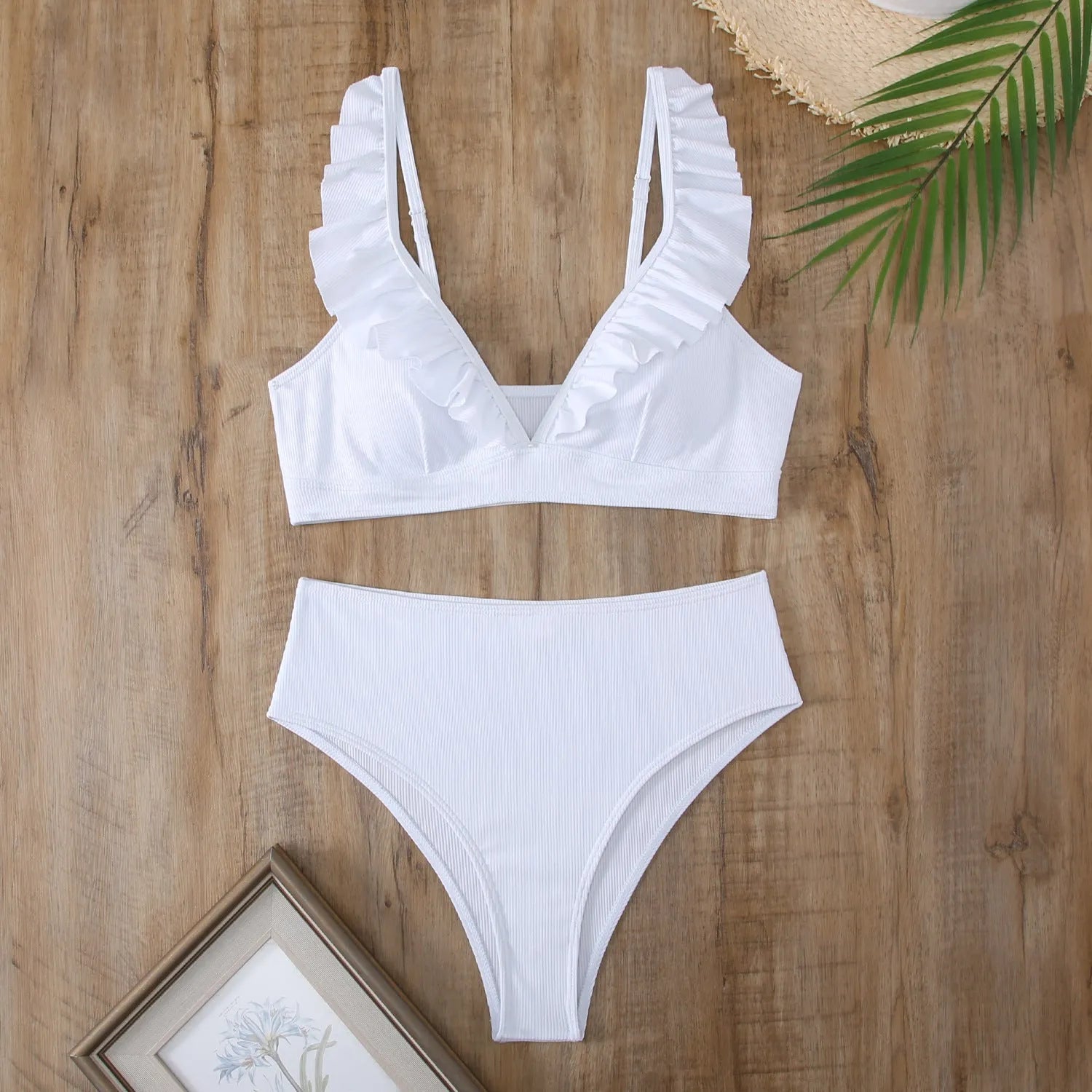 Retro striped split bikini swimsuit in black and white stripes on mannequin