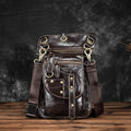 Men's punk fanny pack made from genuine cowhide leather with zipper closure and internal pockets, on display