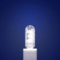 Small white USB LED baby night light showing warm and white light colour options.