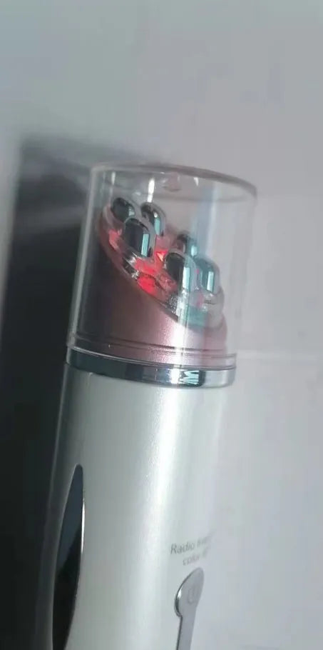 Piano white eye beauty instrument with USB cable, showing negative ion and ultrasonic wave modes