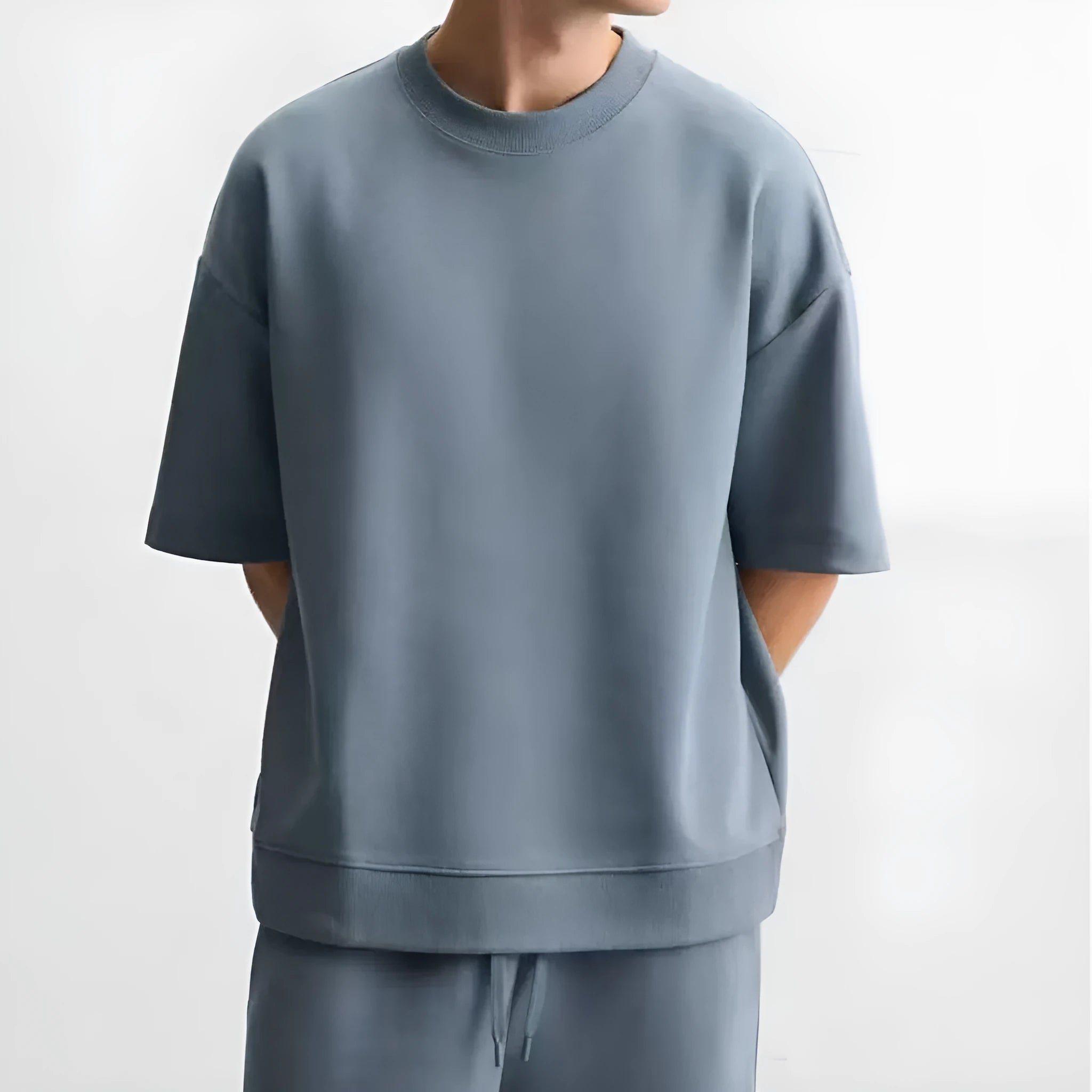 Loose double-sided cloth texture short sleeve top and matching shorts set on a hanger.