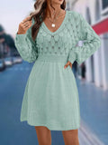 Women's apricot V-neck long sleeve dress with a 3D pattern and high waist on a mannequin.