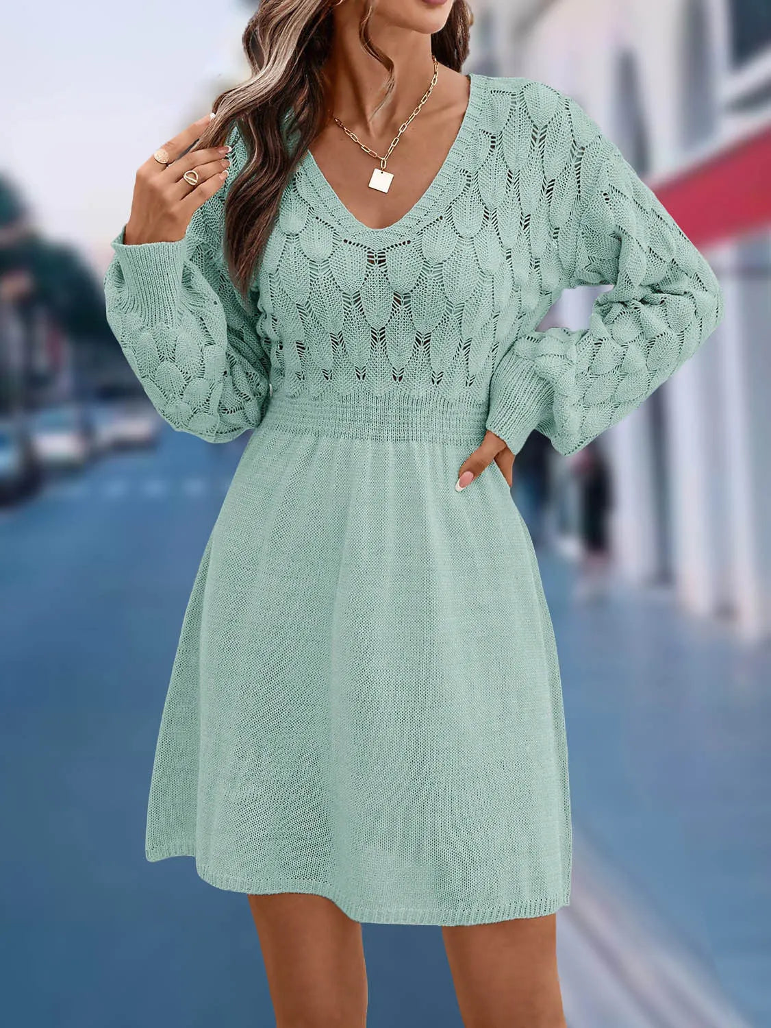 Women's apricot V-neck long sleeve dress with a 3D pattern and high waist on a mannequin.