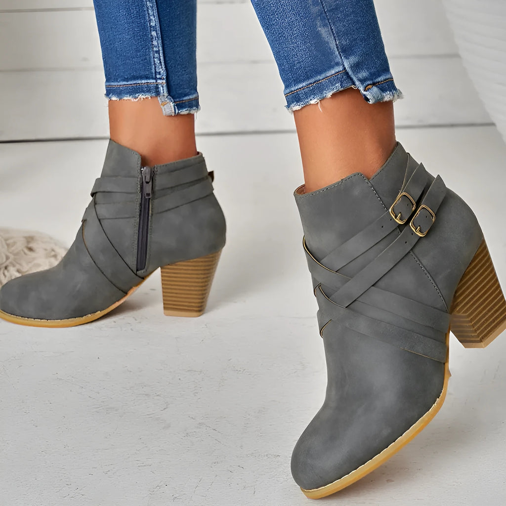 Plus size short ankle boots with a 7cm heel and side zip, shown in grey, black and brown.