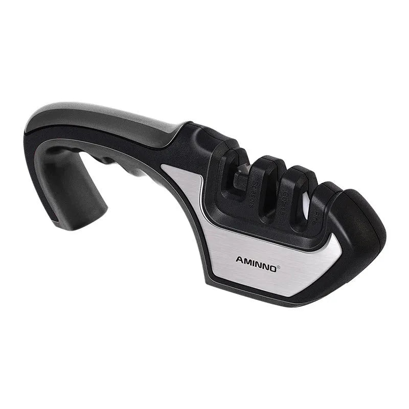 4-in-1 manual kitchen knife and scissor sharpener in black and red, showing multiple sharpening slots.