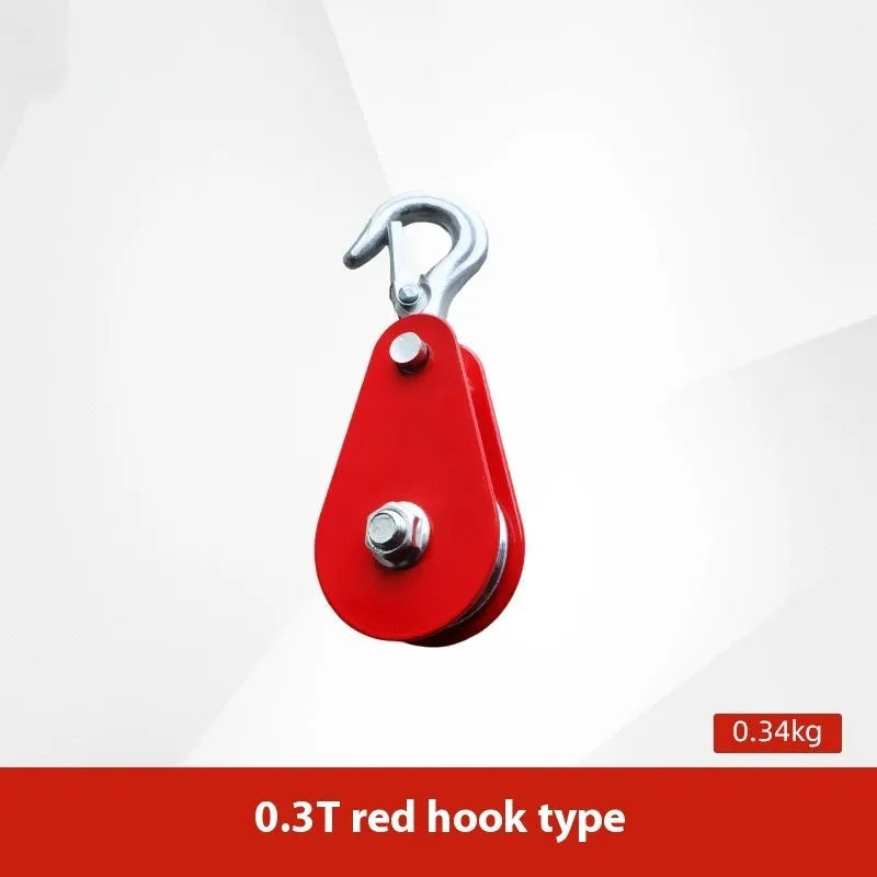 Red industrial lifting pulley with a forged steel safety latch hook and wire rope wheel.
