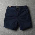 Men's cotton loose shorts in straight-leg cut with zipper fly, shown in multiple colour options including camouflage patterns