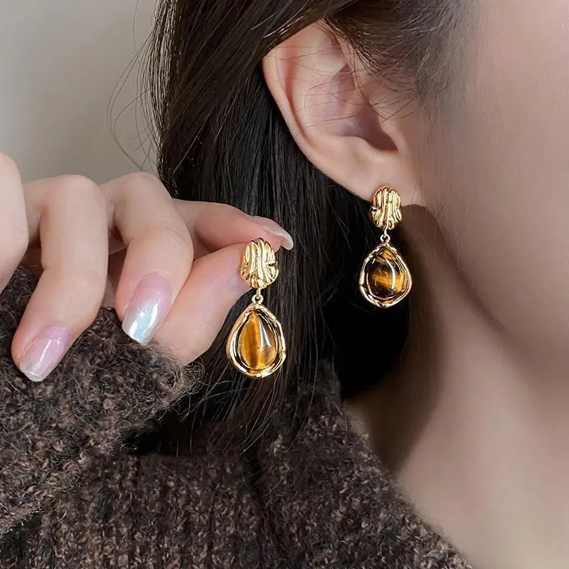 Three pairs of geometric tassel earrings with electroplated finishes in different styles