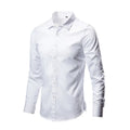 Man wearing a loose-fit light grey linen long-sleeve shirt, casual slim style.