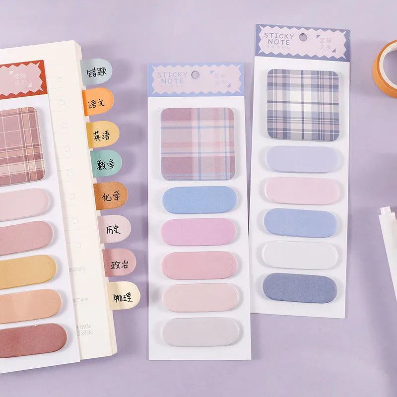 Set of colourful sticky note memo pads in eight designs including plaid and solid colours.