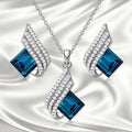 Glass pendant necklace and matching ear stud set with electroplated finish and cross chain style for women