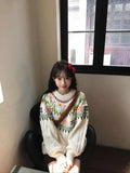 Milky white women's knitwear pullover with loose lantern sleeves and a Mori-style texture.