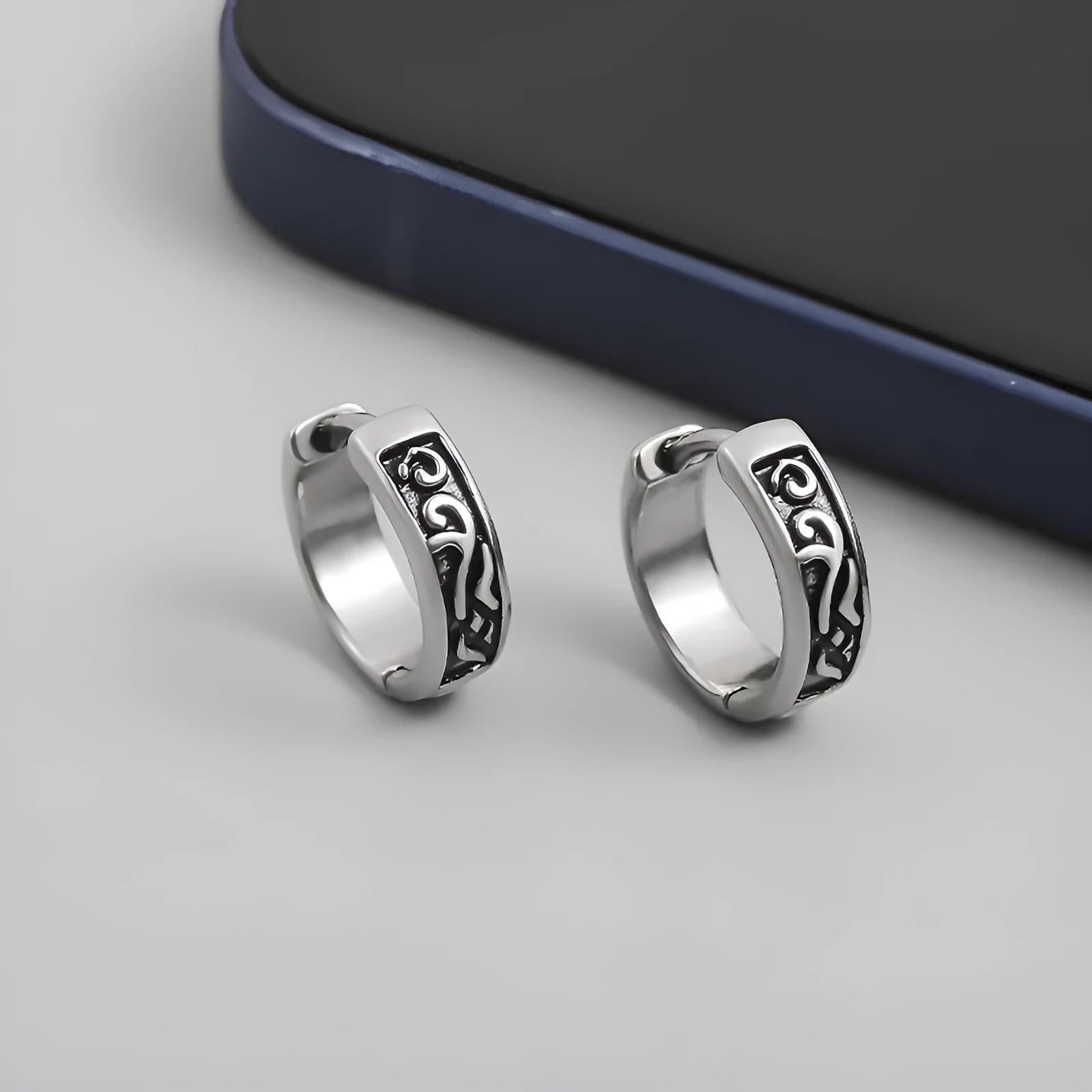 Men's polished copper geometric stud earrings in 10mm and 14mm sizes on a plain background.