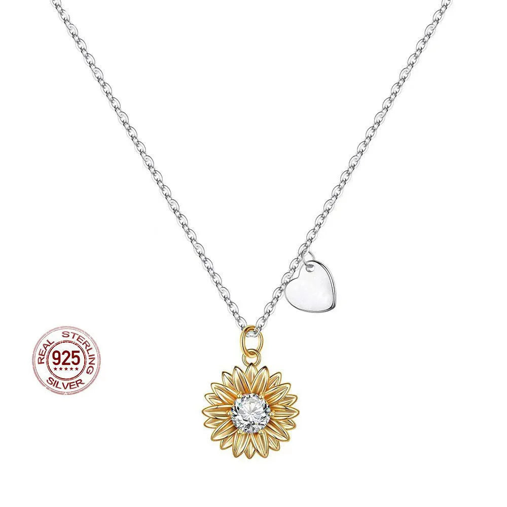 Sunflower and daisy sterling silver pendant on an adjustable cross chain necklace.