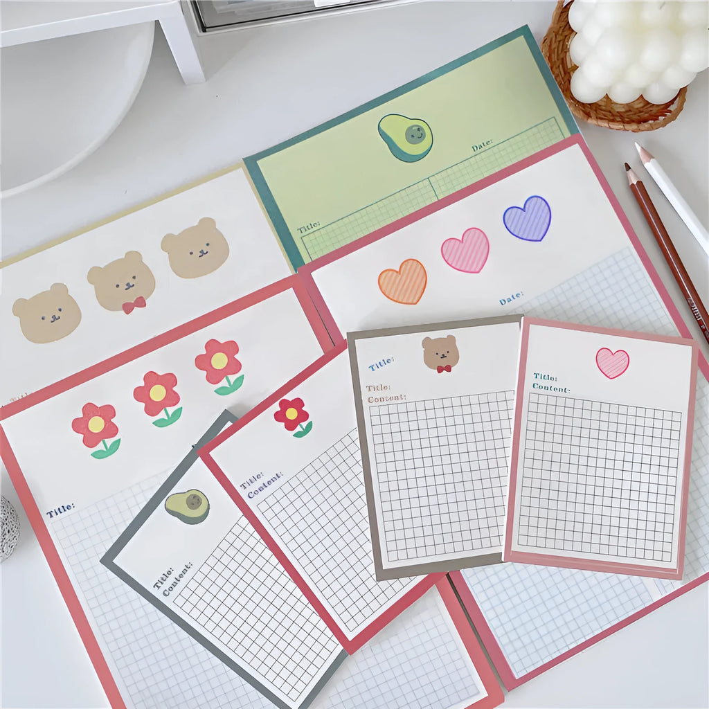 Avocado and bear cartoon design sticky note pads in large and small sizes.