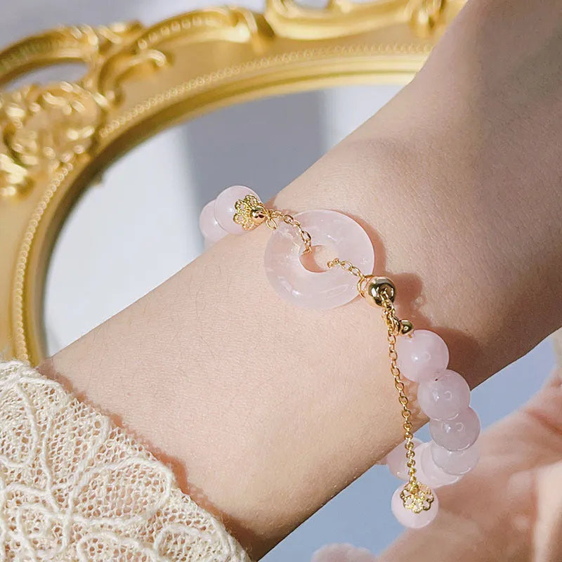 Pink crystal peace buckle bracelet with safety closure for women, adjustable design