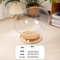 Transparent acrylic space capsule-shaped cat bed on a turntable, showing large size option.