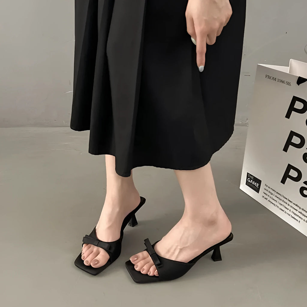 Korean style bow slippers with skirt design, PU upper and rubber sole, black upgraded version
