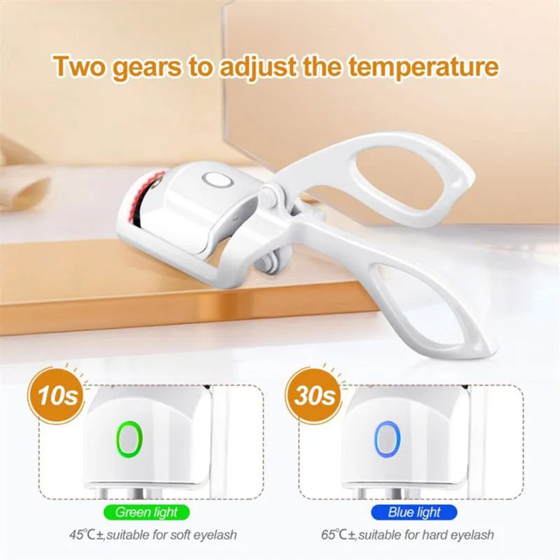 White and pink USB rechargeable heated eyelash curler with dual temperature settings.