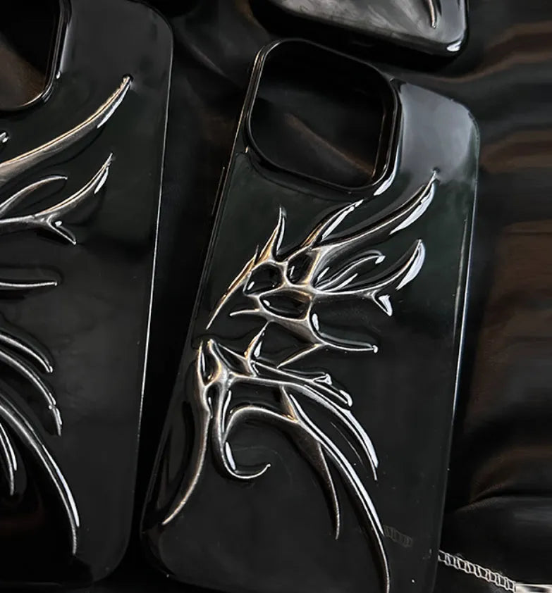 Black iPhone case with three-dimensional wings design showing textured surface