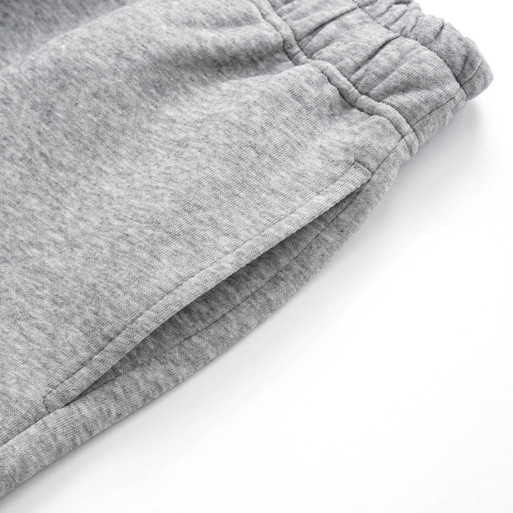 Men's solid colour straight-leg cotton trousers with a loose wide-leg casual fit.